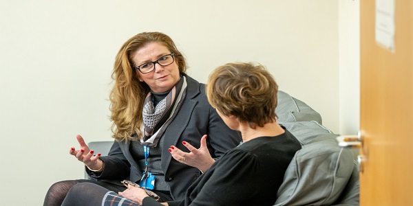 Counsellor talks to patient